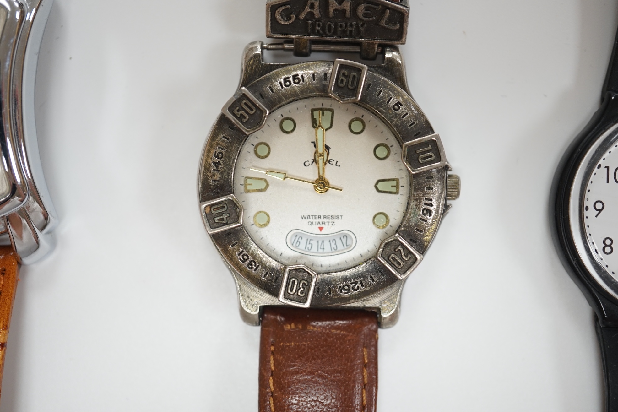 A group of assorted modern wrist watches including Sekonda, Camel and Timex Snoopy, together with two alarm clocks including Mickey Mouse. Condition - poor to fair